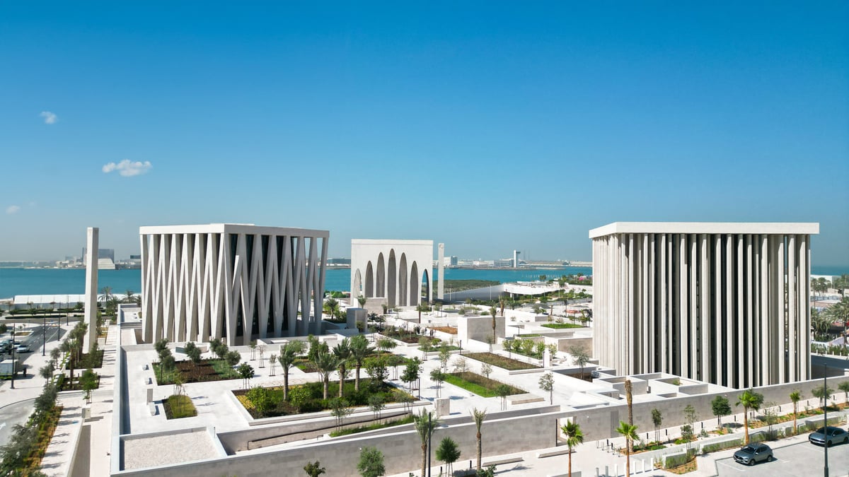 The mosque, church and synagogue of the Abrahamic Family House on Saadiyat Island under a blue sky