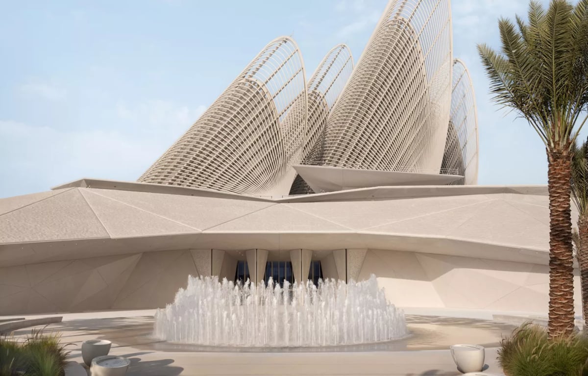 The museum's wing-like towers above a fountain on Saadiyat Island