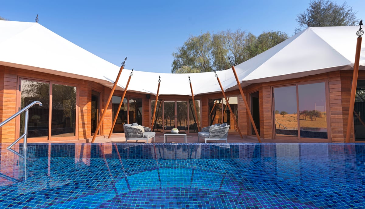 Al Khaimah Villa, private pool in front of the tented villa with timber walls, at The Ritz-Carlton Al Wadi Desert.